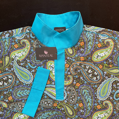 A patterned fabric nightshirt, with turquoise collar and placket, showing a Manteal label.